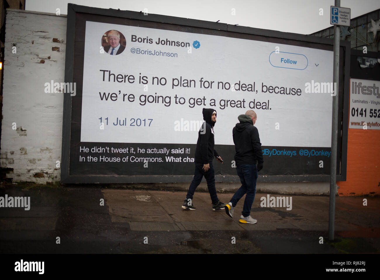 Glasgow, Scotland, 5th February 2019. Billboard by the anti-Brexit group 'Led By Donkeys', showing a quote from Conservative Party MP Boris Johnson in which he talks of the great deal Great Britain would get on leaving the EU, in the East End of Glasgow, Scotland, 5 February 2019. The guerilla billboard campaign is the initiative of six friends who crowdfunded money to be able to post what they believe are the 'country's biggest lies'.  Image Credit: Jeremy Sutton-Hibbert/Alamy Live News. Stock Photo