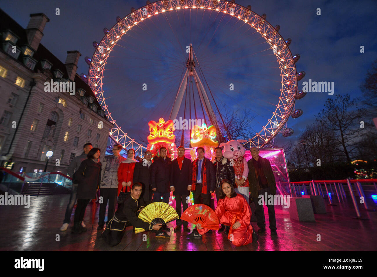 Chinese new year at the London Eye, its the year of the pig and the eye turned red and gold to celebrate the new year. LCCA Festival of Spring Celebrations in London. Stock Photo