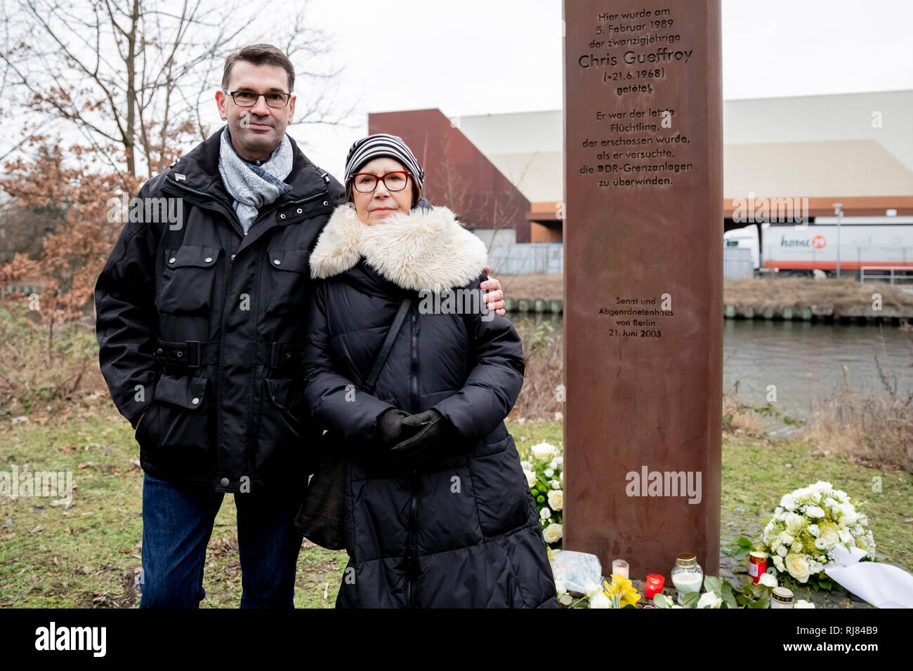 Berlin, Germany. 05th Feb, 2019. Stephan Gueffroy, brother of Chris Gueffroy, and Karin Gueffroy, mother of Chris Gueffroy, are commemorating the 30th anniversary of the death of Chris Gueffroy at a memorial stele on the Britzer branch canal. There Gueffroy was shot 30 years ago during an escape attempt at the Berlin Wall. He's the last person to die using a firearm. Credit: Christoph Soeder/dpa/Alamy Live News Stock Photo