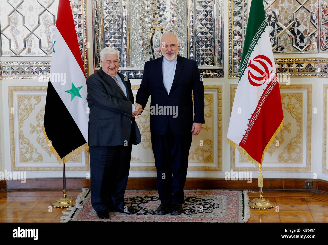 (190205) -- TEHRAN, Feb. 5, 2019 (Xinhua) -- Iranian Foreign Minister Mohammad Javad Zarif (R) shakes hands with visiting Syrian Foreign Minister Walid Muallem in Tehran, capital of Iran, on Feb. 5, 2019. Iran pledged on Tuesday full support to Syria facing threats from terrorists and Israel. (Xinhua/Ahmad Halabisaz) Stock Photo
