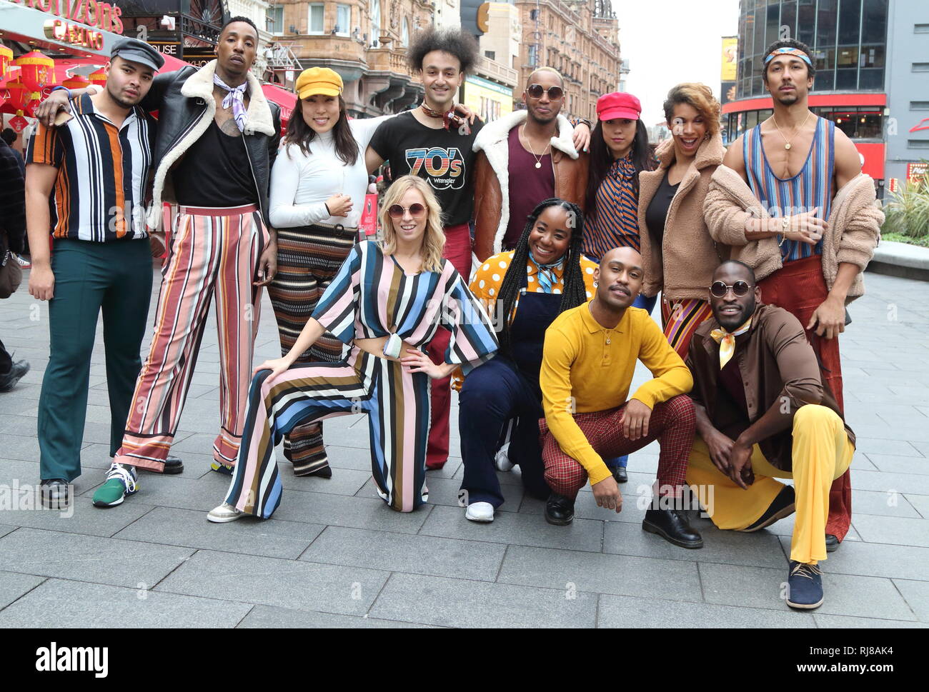 The American Soul crew seen posing together for a photo. In honour of the BET (Black Entertainment Television) Network’s groovy new period drama, American Soul, a flash mob dance take-over on the streets of London. Stock Photo