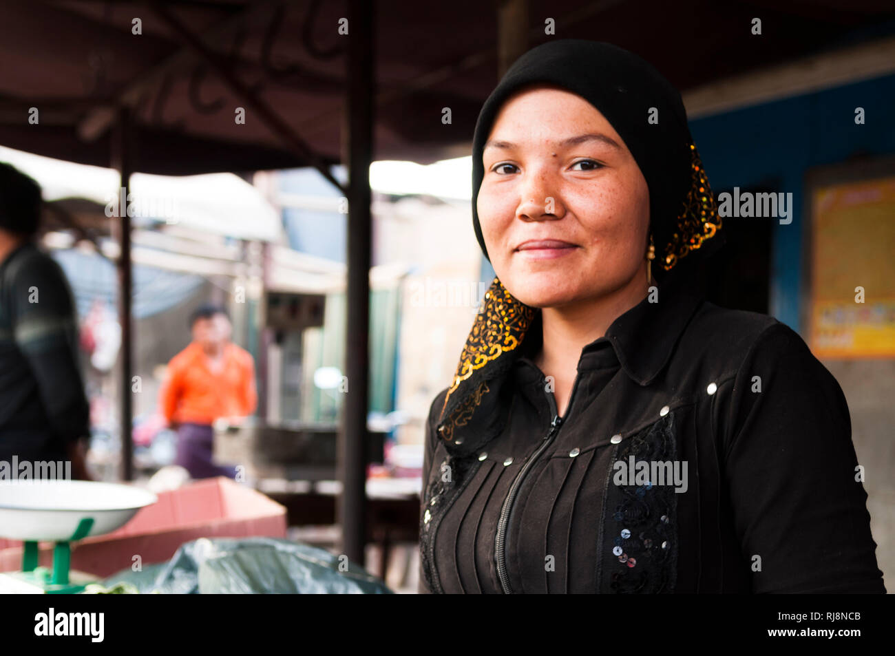 Uigurin auf dem Markt von Turfan Stock Photo