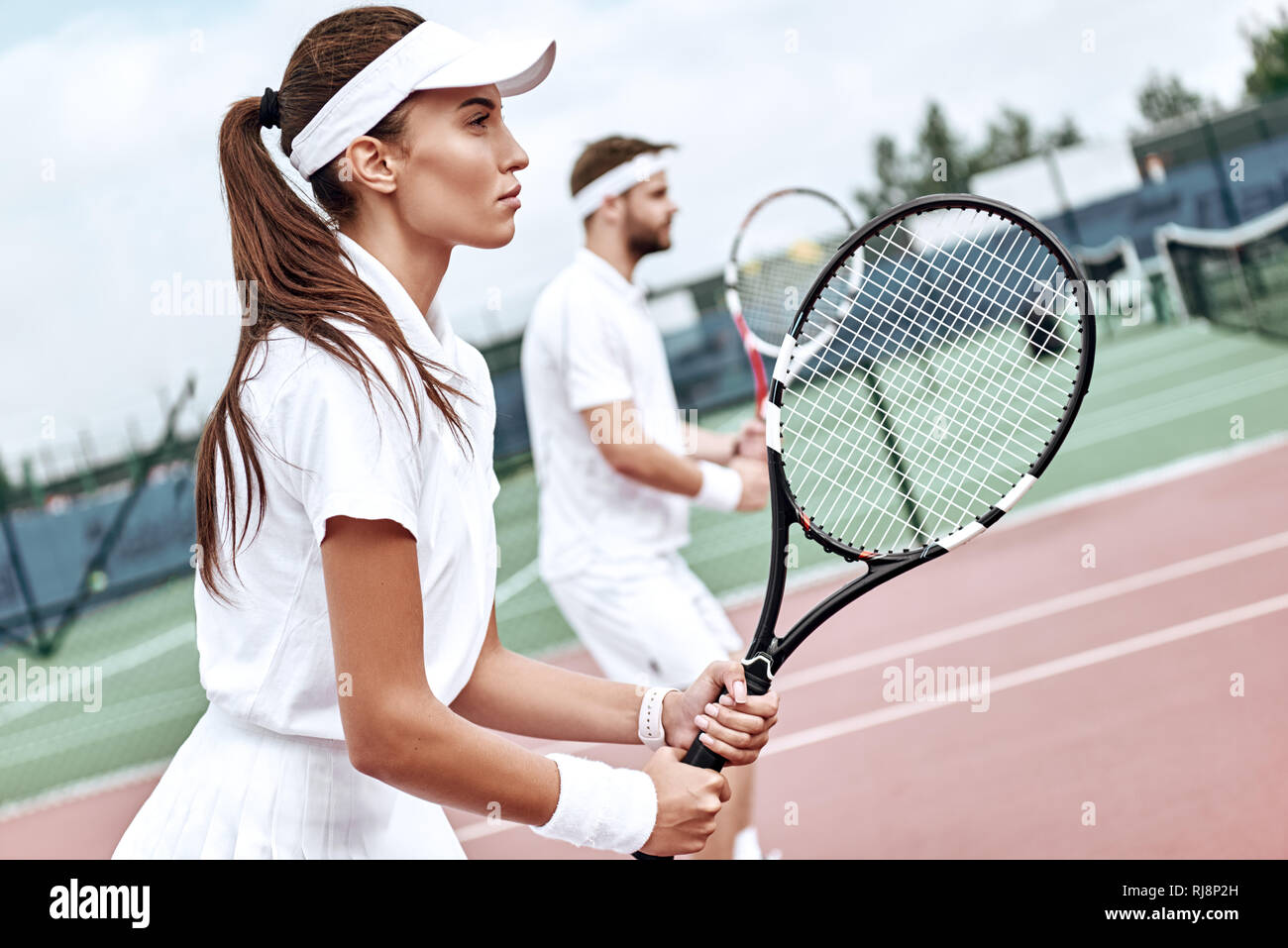 Couple in tennis outfit hi-res stock photography and images - Alamy