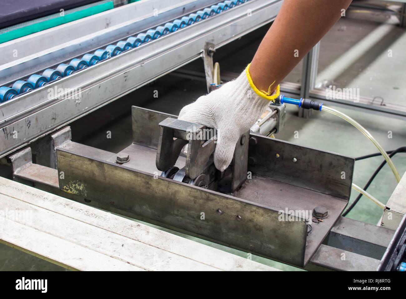 worker maintenance and repair conveyor belt in factory Stock Photo Alamy