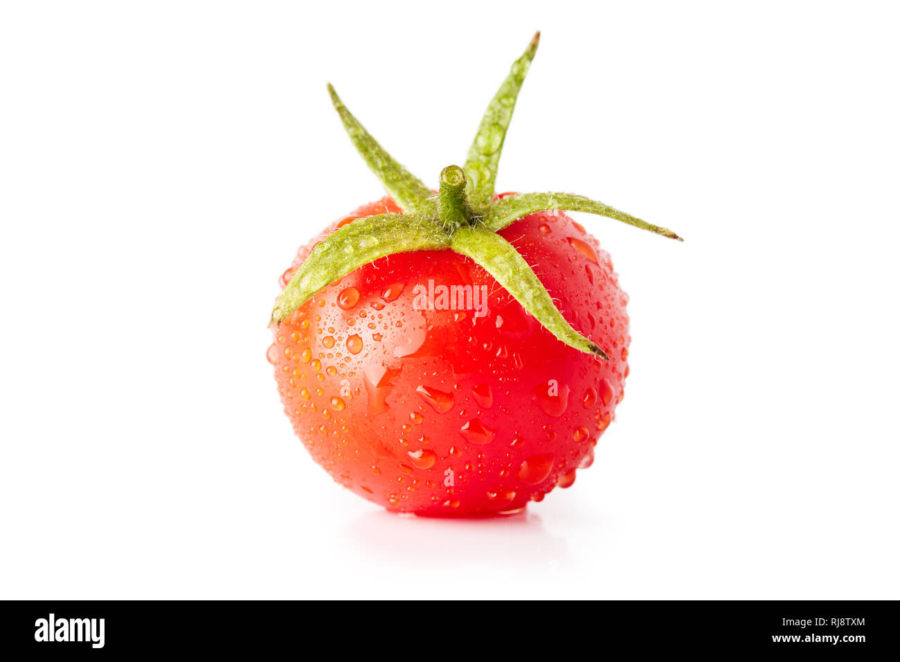 Fresh ripe organic tomato with water drops isolated on white background ...