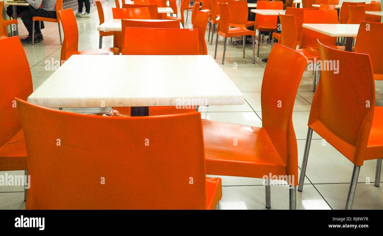 Empty Yellow Color Chairs Arranged In The Row With The