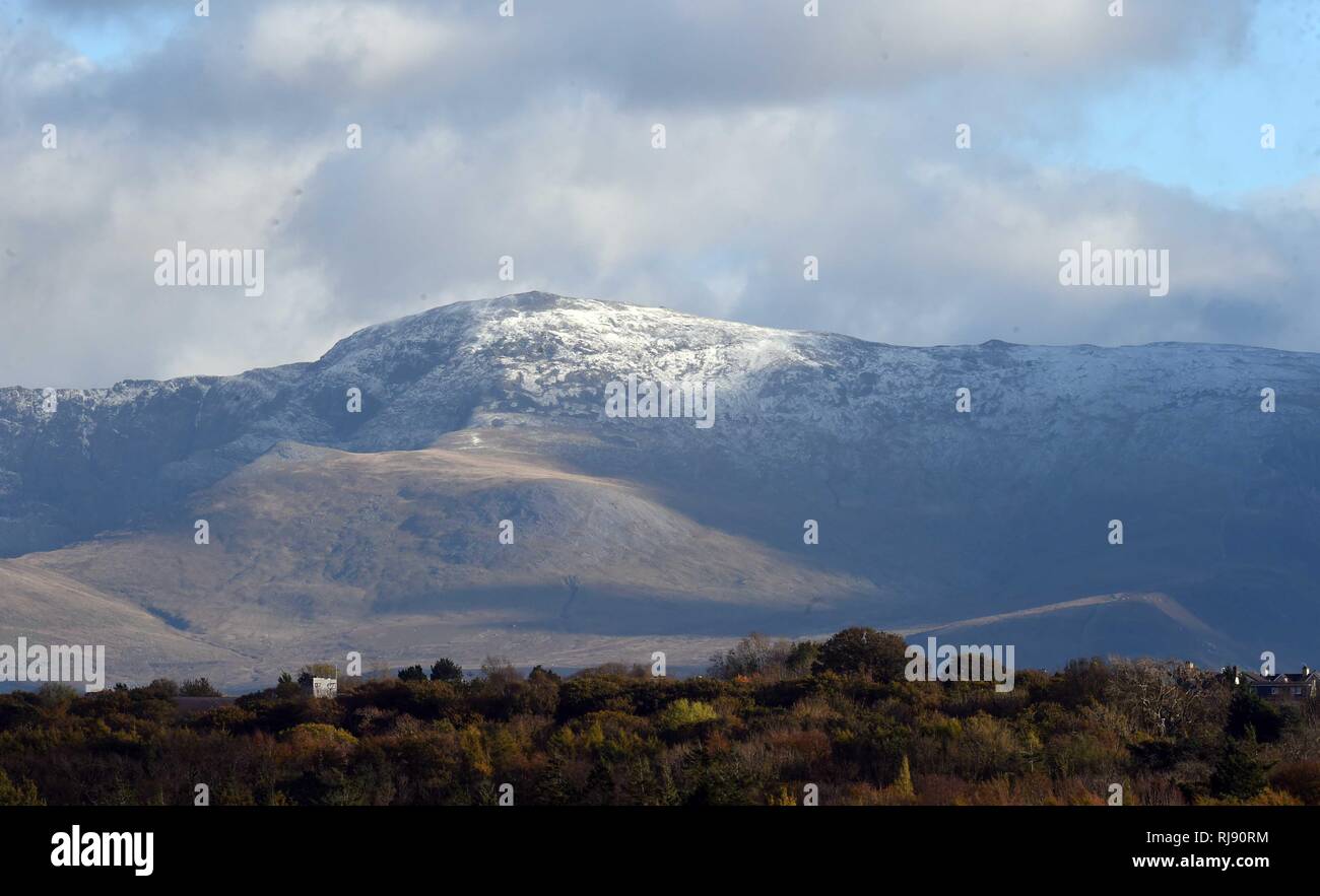Firts snow of the winter in Snowdonia taken from Anglesey,  Carnedd Dafydd, Sunday 28th October 2018. Stock Photo