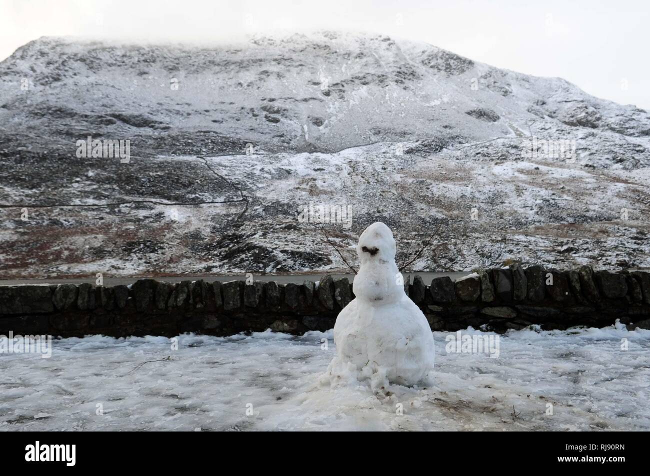 WEATHER - Snow and Ice on The A5 in the Ogwen Valley. Snowdonia  Dyffryn Ogwen coverd in snow  Snowman on the pass Tuesday 22nd January 2019. Stock Photo