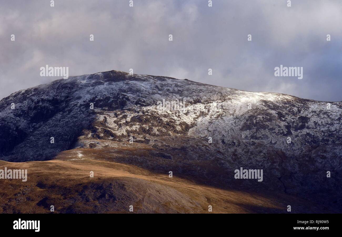 First snow of the winter in Snowdonia taken from Anglesey, Carnedd Dafydd, Sunday 28th October 2018. = Stock Photo