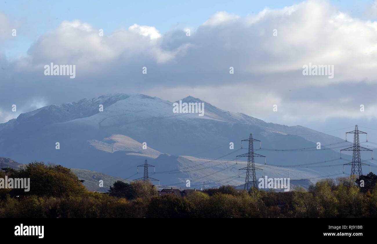Firts snow of the winter in Snowdonia taken from Anglesey,  Snowdon, Sunday 28th October 2018. Stock Photo