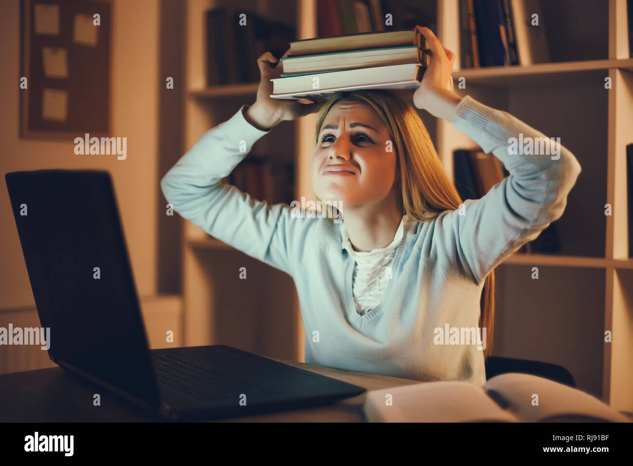 Student has too much to learn at home. Stock Photo