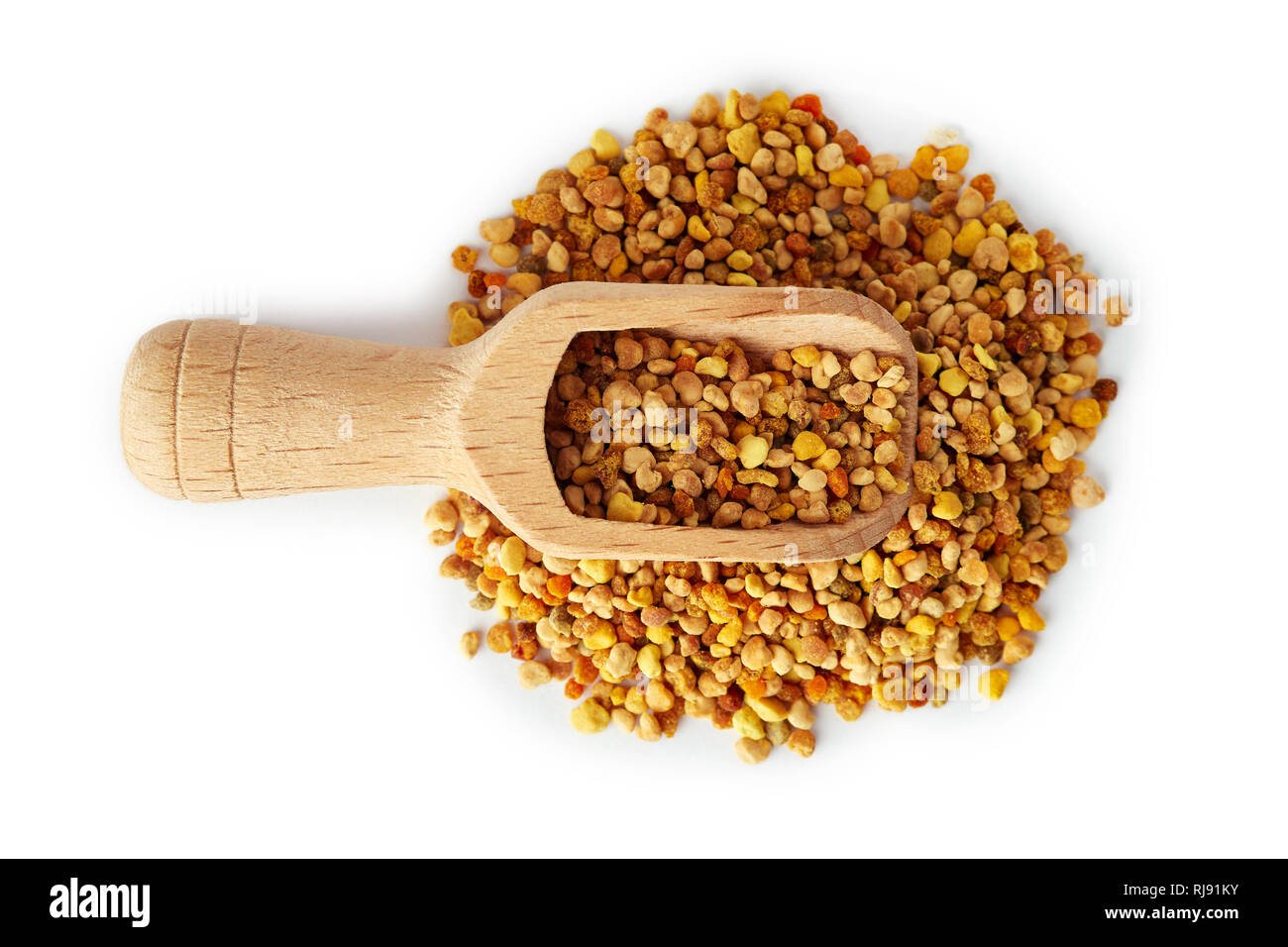 Bee pollen grains in wooden scoop isolated on white background Stock Photo