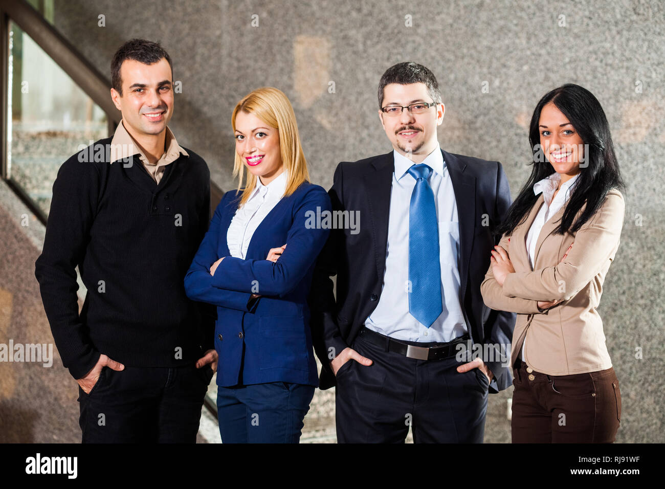 Group posing four people hi-res stock photography and images - Alamy