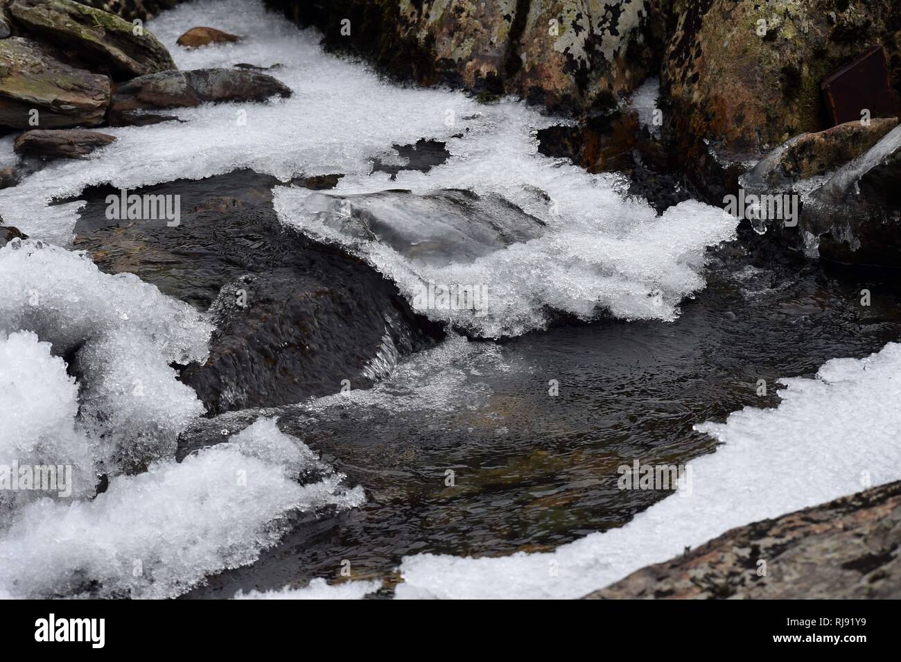 WEATHER - Due to the freezing weather the river Peris which runs down Llanberis pass has frozen. Monday 26th February 2018. Stock Photo