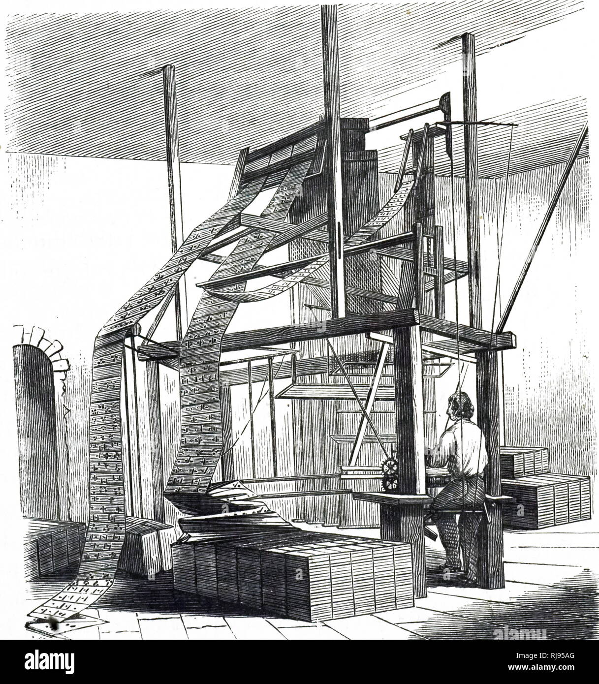 An engraving depicting a Jacquard Loom. The jacquard punched cards can be seen above the weaver's head. Dated 19th century Stock Photo