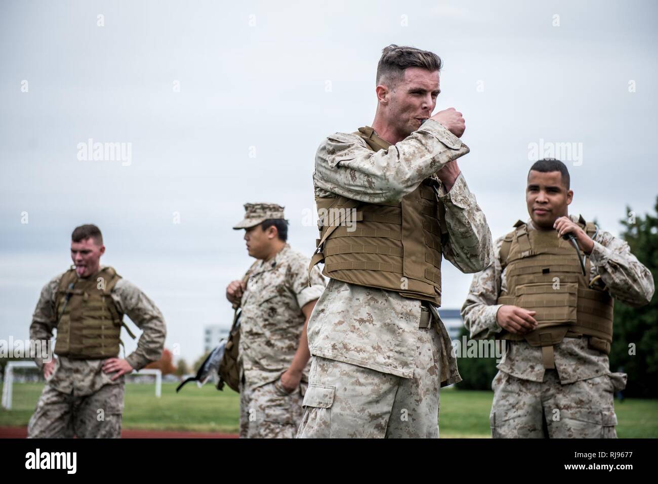 Marine Cpl. William J. Back sucks down water before the next exercise