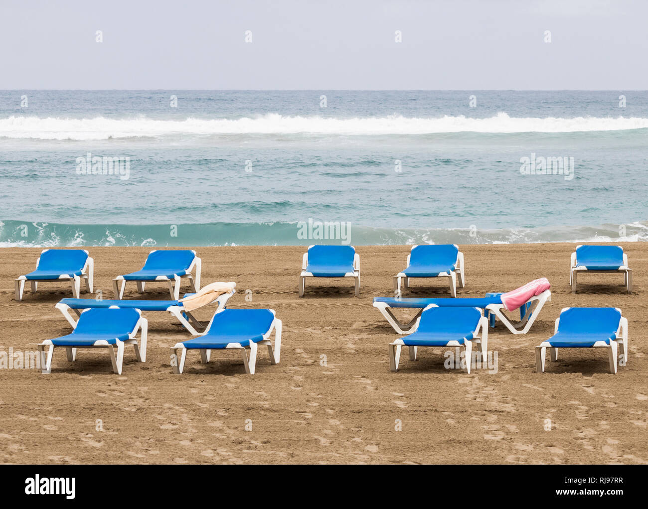 Towels on beach sunloungers in Spain Stock Photo