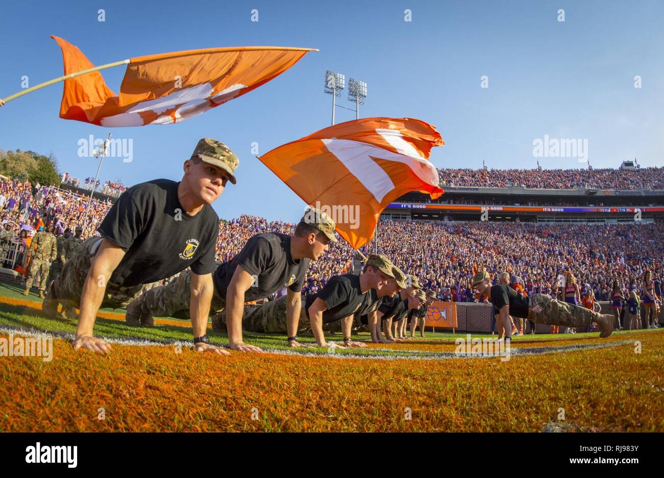 Cadets with Clemson University’s Reserve Officers’ Training Corps do 22 push-ups on the field of Memorial Stadium after the Clemson Tigers scored a touchdown during the Military Appreciation Game against Syracuse, Nov. 5, 2016. Stock Photo