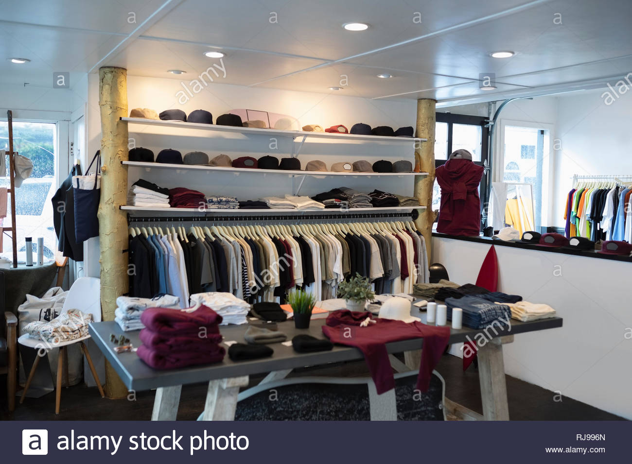Merchandise on display in menswear clothing shop Stock Photo