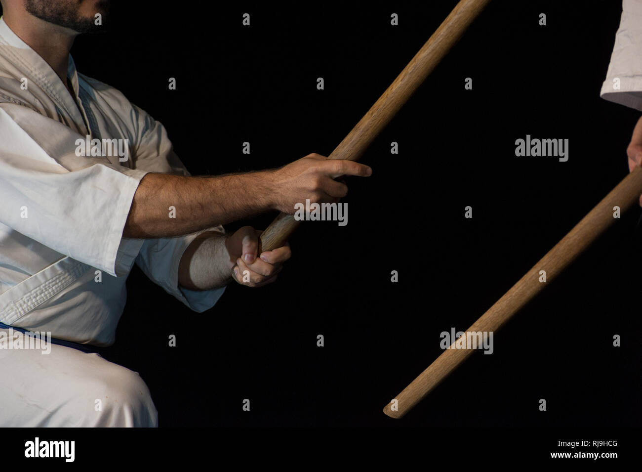 Aikido fighter with his wood stick during a combat Stock Photo Alamy