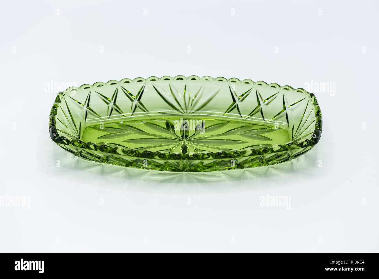 a green glass relish tray or candy dish Stock Photo