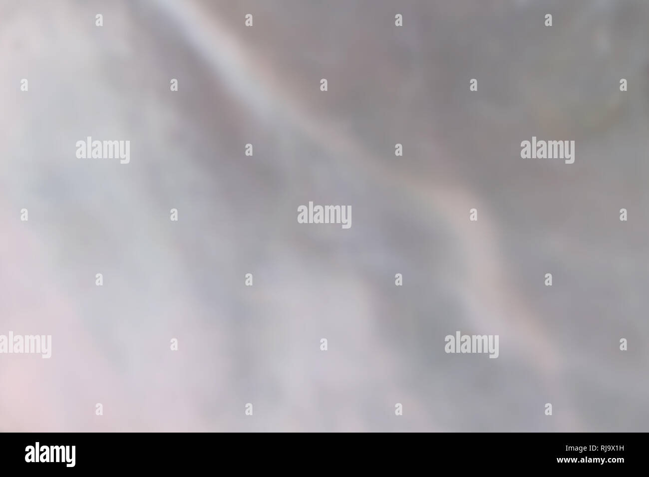 Abstract pearl background with shimmering nacreous mother of pearl grey and pink colours Stock Photo