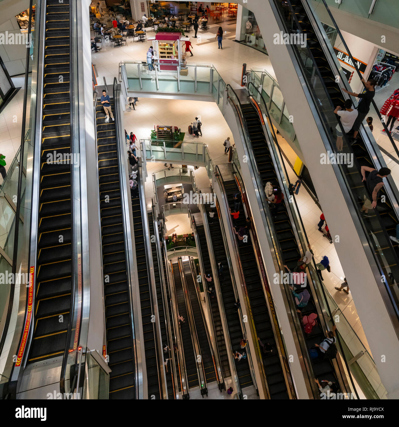 view of the escalators inside the SURIA shopping mall in Kuala Lumpur, Malaysia Stock Photo