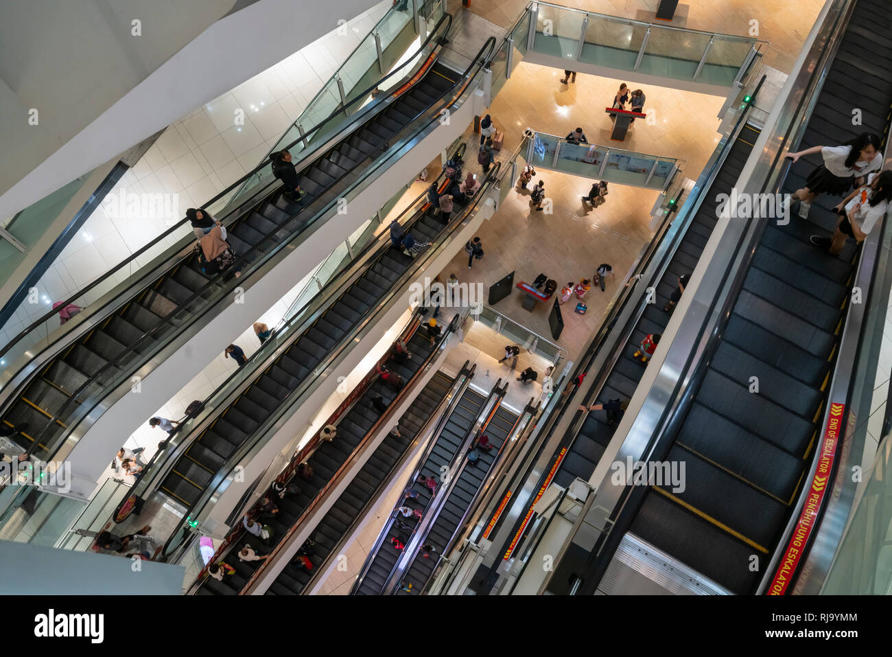 view of the escalators inside the SURIA shopping mall in Kuala Lumpur, Malaysia Stock Photo