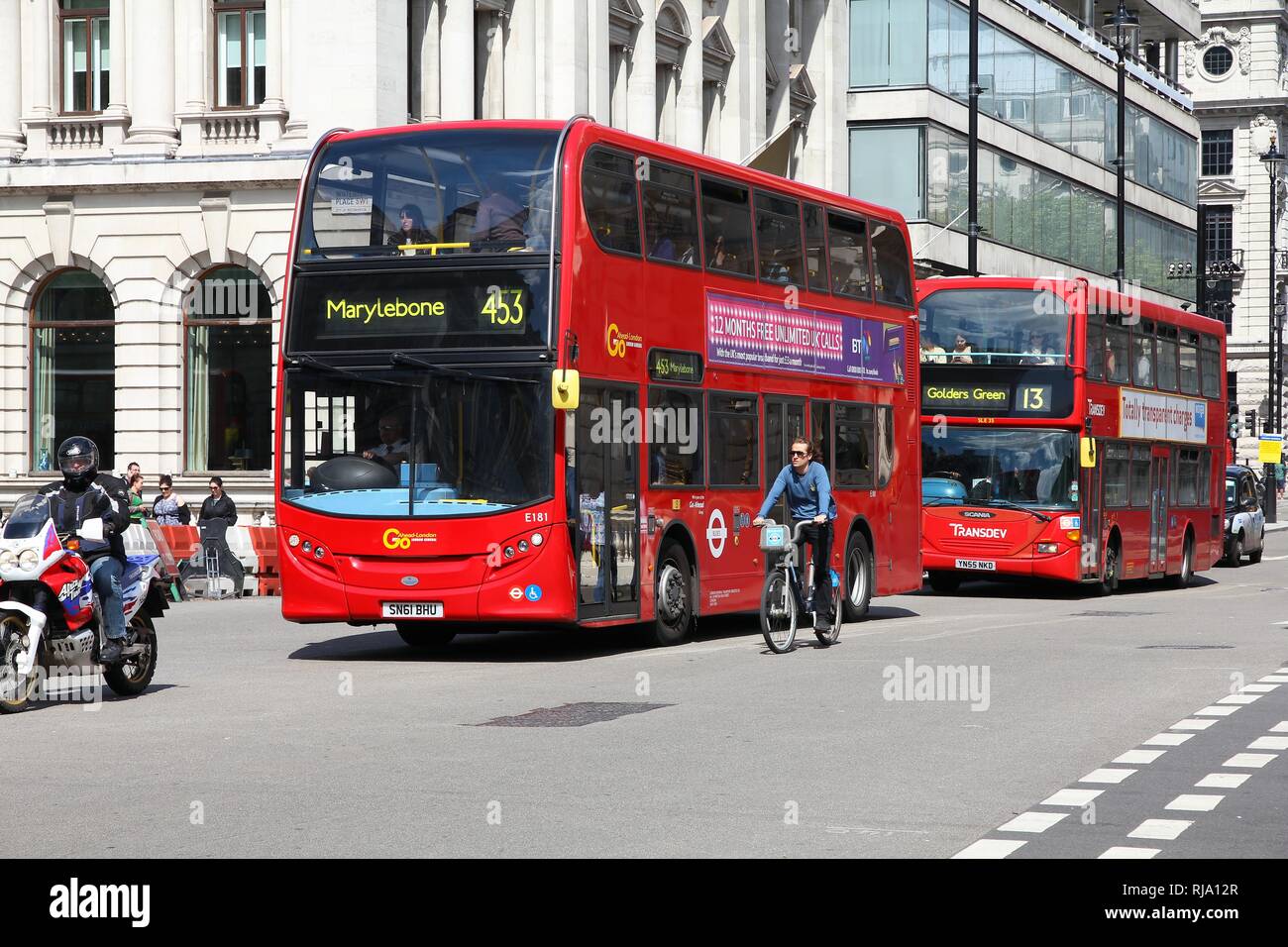 LONDON, UK - MAY 13, 2013: People ride London Buses in London. As of 2012, LB serves 19,000 bus stops with a fleet of 8000 buses. On a weekday 6 milli Stock Photo