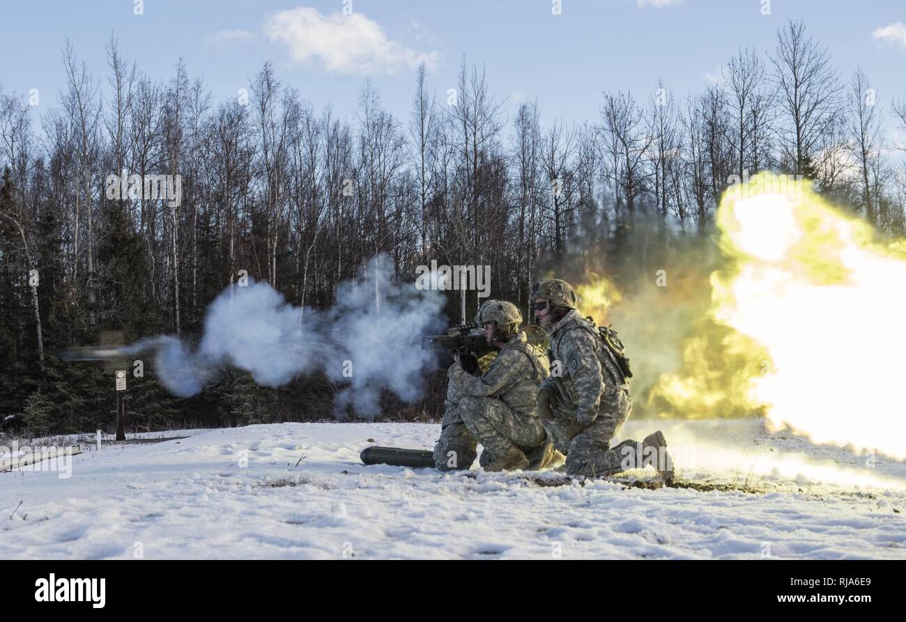 Paratroopers assigned to Baker Company, 3rd Battalion, 509th Parachute Infantry Regiment, 4th Infantry Brigade Combat Team (Airborne) 25th Infantry Division, U.S. Army Alaska, fire the Carl Gustaf recoilless rifle system at Joint Base Elmendorf-Richardson, Alaska, Nov. 1, 2016.  The Carl Gustaf is a man-portable, breach-loading, 84mm recoilless rifle capable of destroying armored targets from up to 700 meters away. The paratroopers conducted live fire training to hone their proficiency. Stock Photo