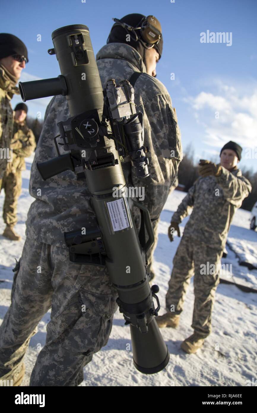 Spc. Dino Torres, a native of Los Angeles, Calif., assigned to Baker Company, 3rd Battalion, 509th Parachute Infantry Regiment, 4th Infantry Brigade Combat Team (Airborne) 25th Infantry Division, U.S. Army Alaska, carries a Carl Gustaf recoilless rifle system during live fire training at Joint Base Elmendorf-Richardson, Alaska, Nov. 1, 2016.  The Carl Gustaf is a man-portable, breach-loading, 84mm recoilless rifle capable of destroying armored targets from up to 700 meters away. The paratroopers conducted the live fire training to hone their proficiency. Stock Photo