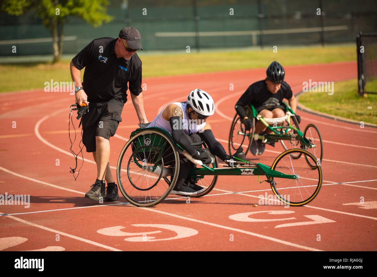 U.S. Soldiers line up and prepare to start the 100 meter wheelchair dash during the Track event of the Regional Health Command-Atlantic 2016 Warrior Games Regional Trials at Wildwood Park in Columbus, Ga., Nov. 2, 2016. The Regional Health Command-Atlantic is one of the four Army Regional Health Command's hosting regional trials across the country. Regional competitors who excel in the qualifying events will advance to the Army Warrior Games at Fort Bliss, Texas in February 2017. Stock Photo