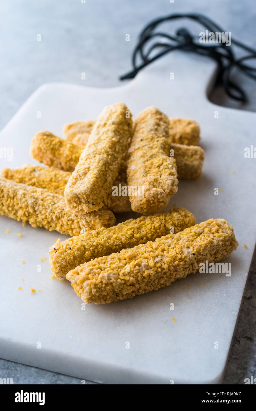 Raw Frozen Breaded Mozzarella Cheese Sticks Ready to Fry in Pan. Fast