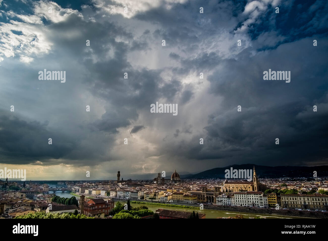 Panoramic aerial view on town from Piazza Michelangelo, dark thunderstorm clouds building up Stock Photo