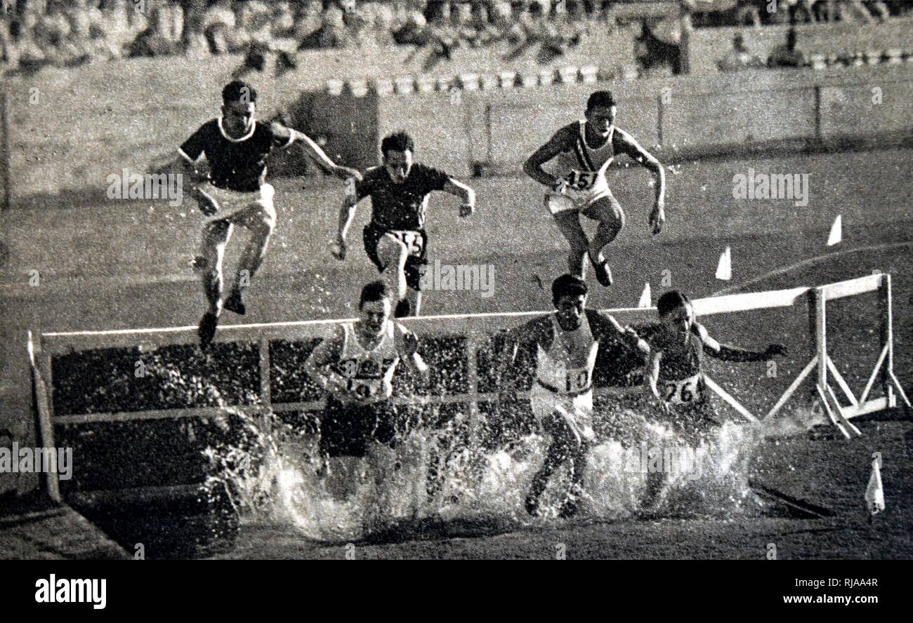 Photograph of the 3000 Meter Steeplechase during the 1932 Olympic games. Won by Volmari Iso-Hollo (1907 - 1969) from Finland. Volmari was one of the last Flying Finns who dominated long distance running. Volmari broke the world record at 09.09.4. Stock Photo