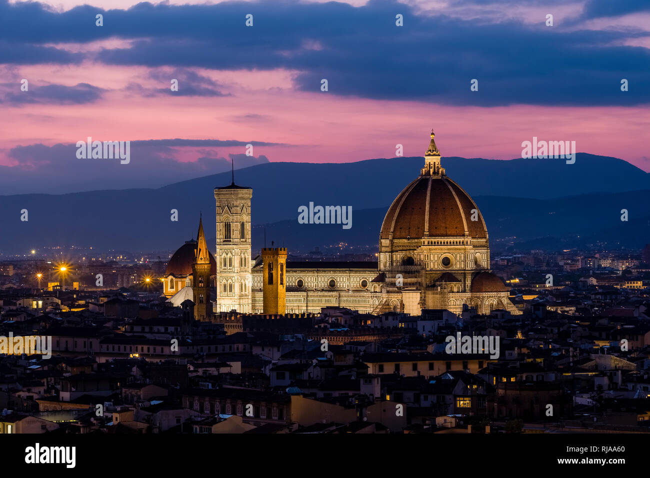 Aerial view on the illuminated town from Piazza Michelangelo at night, Duomo standing out Stock Photo