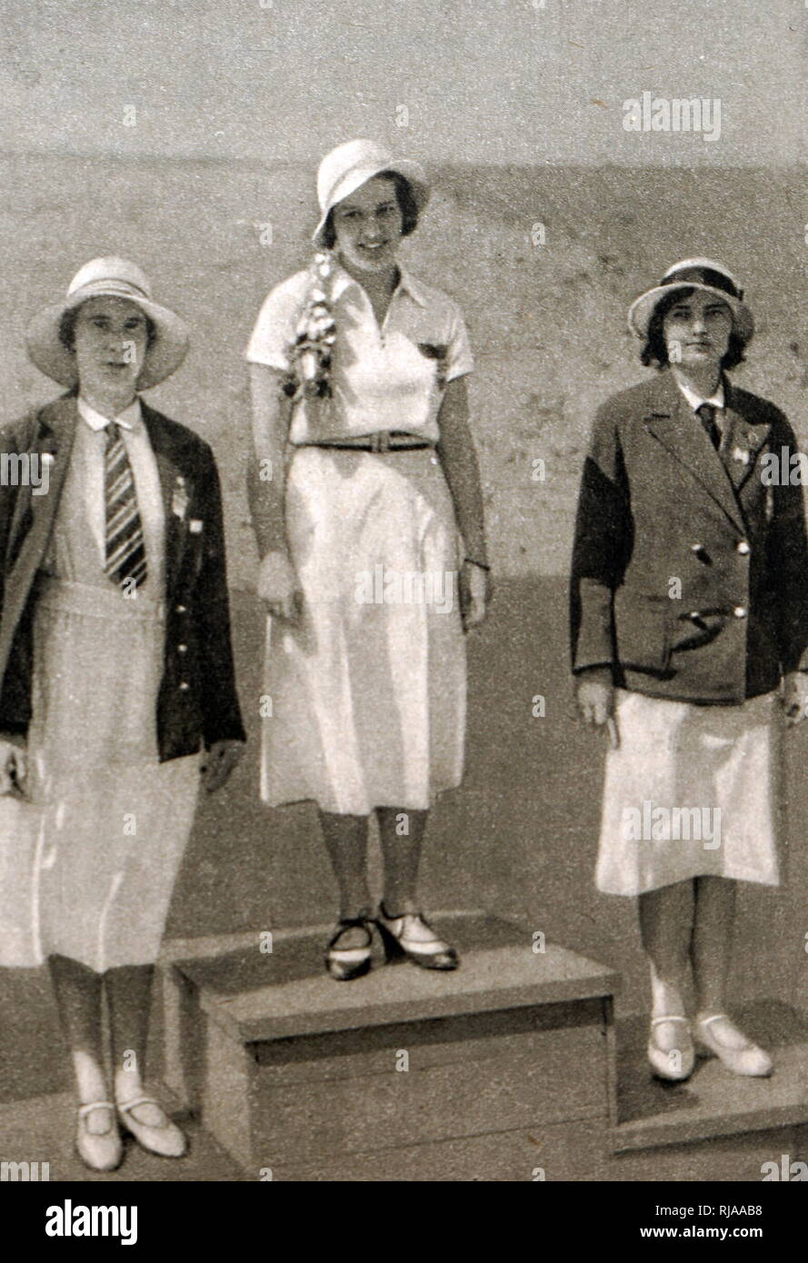 Photograph of the podium for the women's foil at the 1932 Olympic games. Ellen Müller-Preis (1912 - 2007) took gold for Austria, Heather Seymour 'Judy' Guinness (1910 - 1952) silver for Great Britain & bronze Erna Bogen-Bogáti (1906 - 2002) of Hungary. Stock Photo