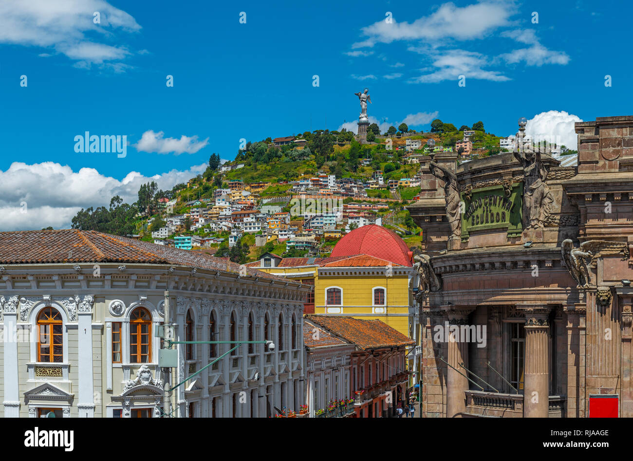 Cityscape of colonial architecture in the historic city center of Quito with the Panecillo hill and the Virgin of Quito in the background, Ecuador. Stock Photo