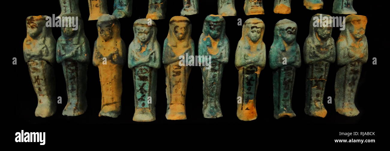 ushabti (Shabti or shawabti), funerary figurines used in Ancient Egypt. Ushabti were placed in tombs among the grave goods and were intended to act as servants or minions for the deceased, should they be called upon to do manual labour in the afterlife. Stock Photo