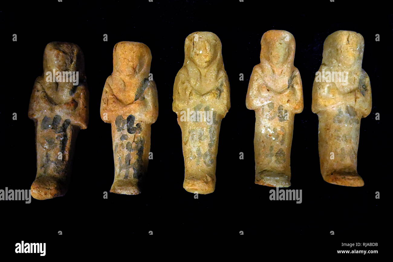 ushabti (Shabti or shawabti), funerary figurines used in Ancient Egypt. Ushabti were placed in tombs among the grave goods and were intended to act as servants or minions for the deceased, should they be called upon to do manual labour in the afterlife. Stock Photo
