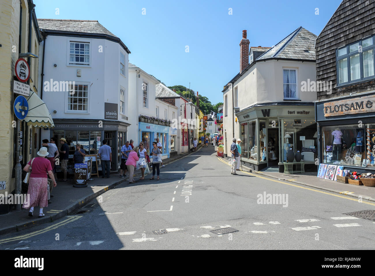Tourists shopping on a sunny summers day on Lanadwell Street in Padstow