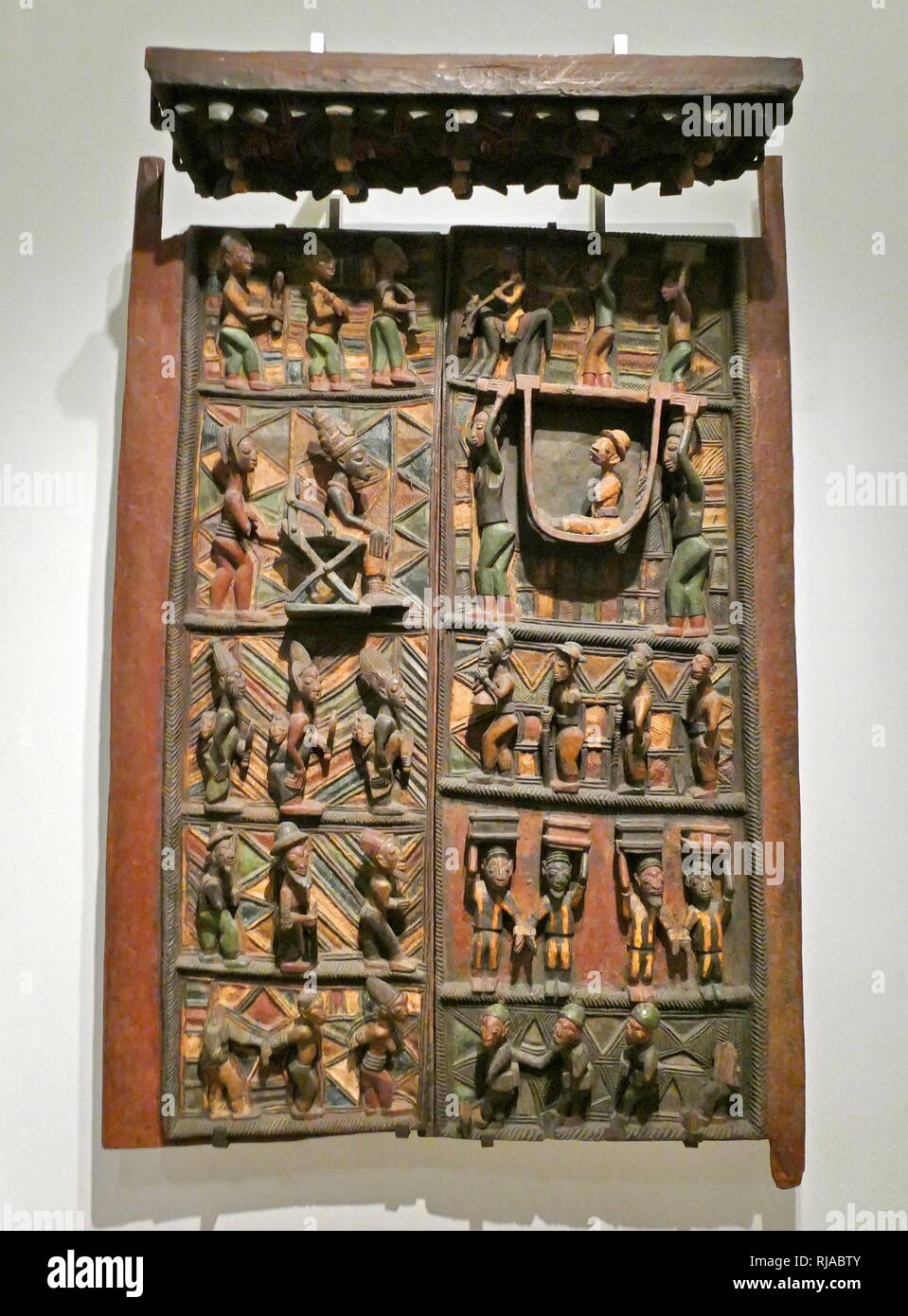 door panels and a lintel made from wood. Yoruba people, Nigeria, 1910-1914. carved by Olowe of Ise for the royal palace at Ikere. commemorating the reception by the Ogoga (king) in 1901, of the first British administrator, Captain Ambrose. Stock Photo