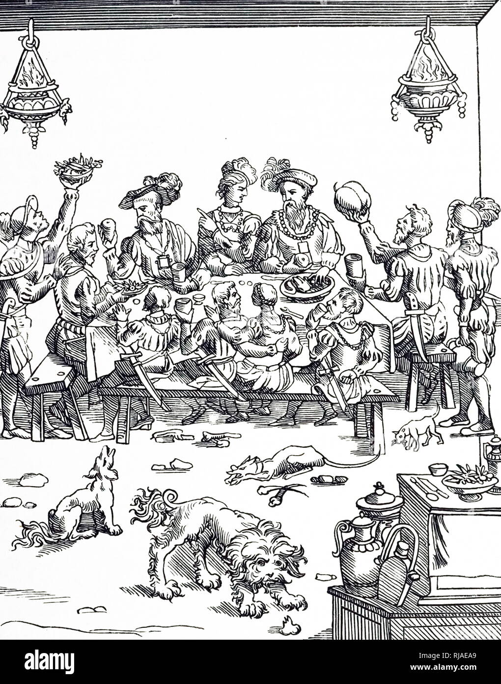 A woodcut engraving depicting a medieval banquet. Dated 16th century Stock Photo