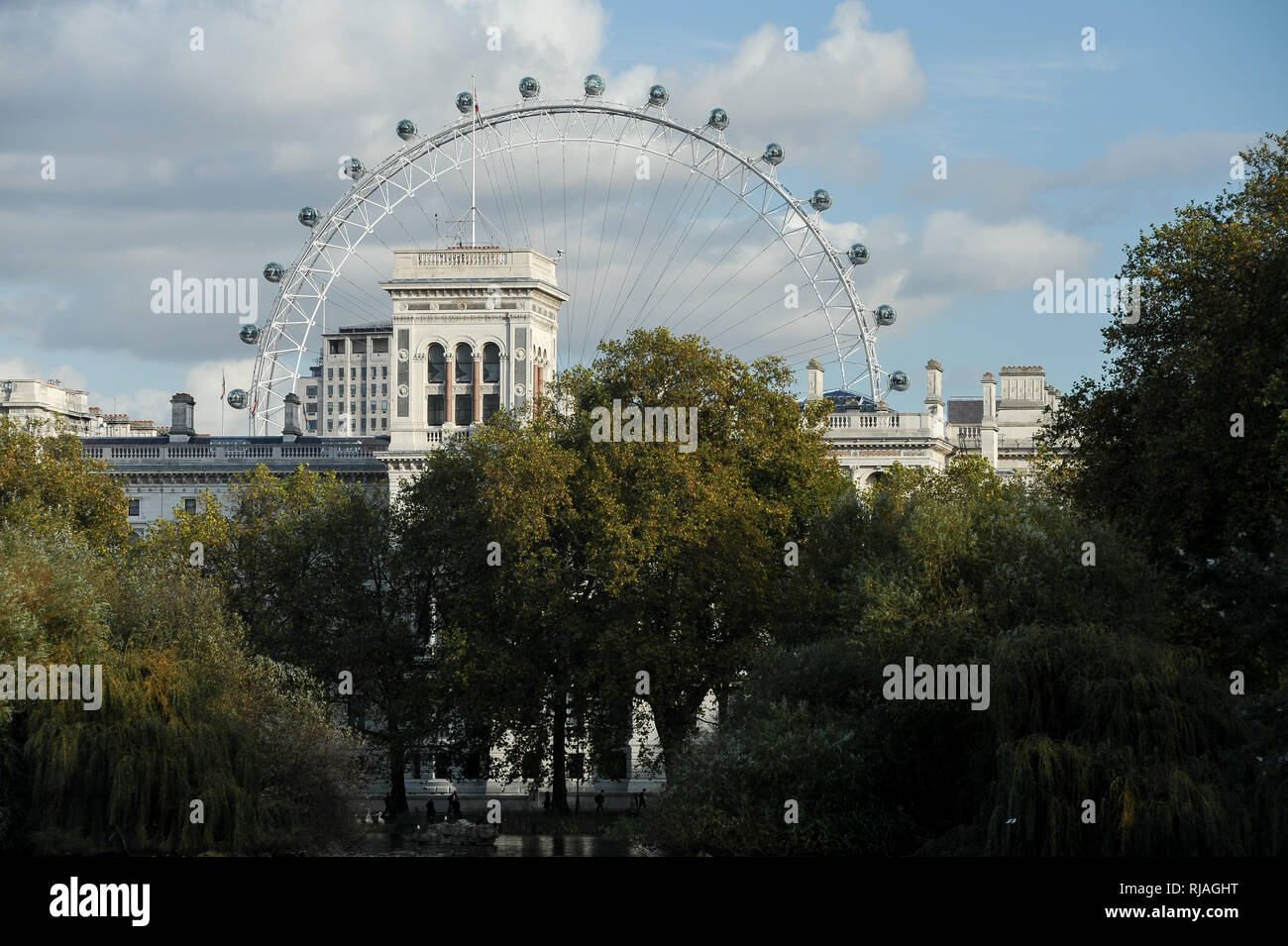 St James Park Lake in St James Park, Foreign and Commonwealth Office, Shell Centre building and London Eye seen from Blue Bridge in London, England, U Stock Photo