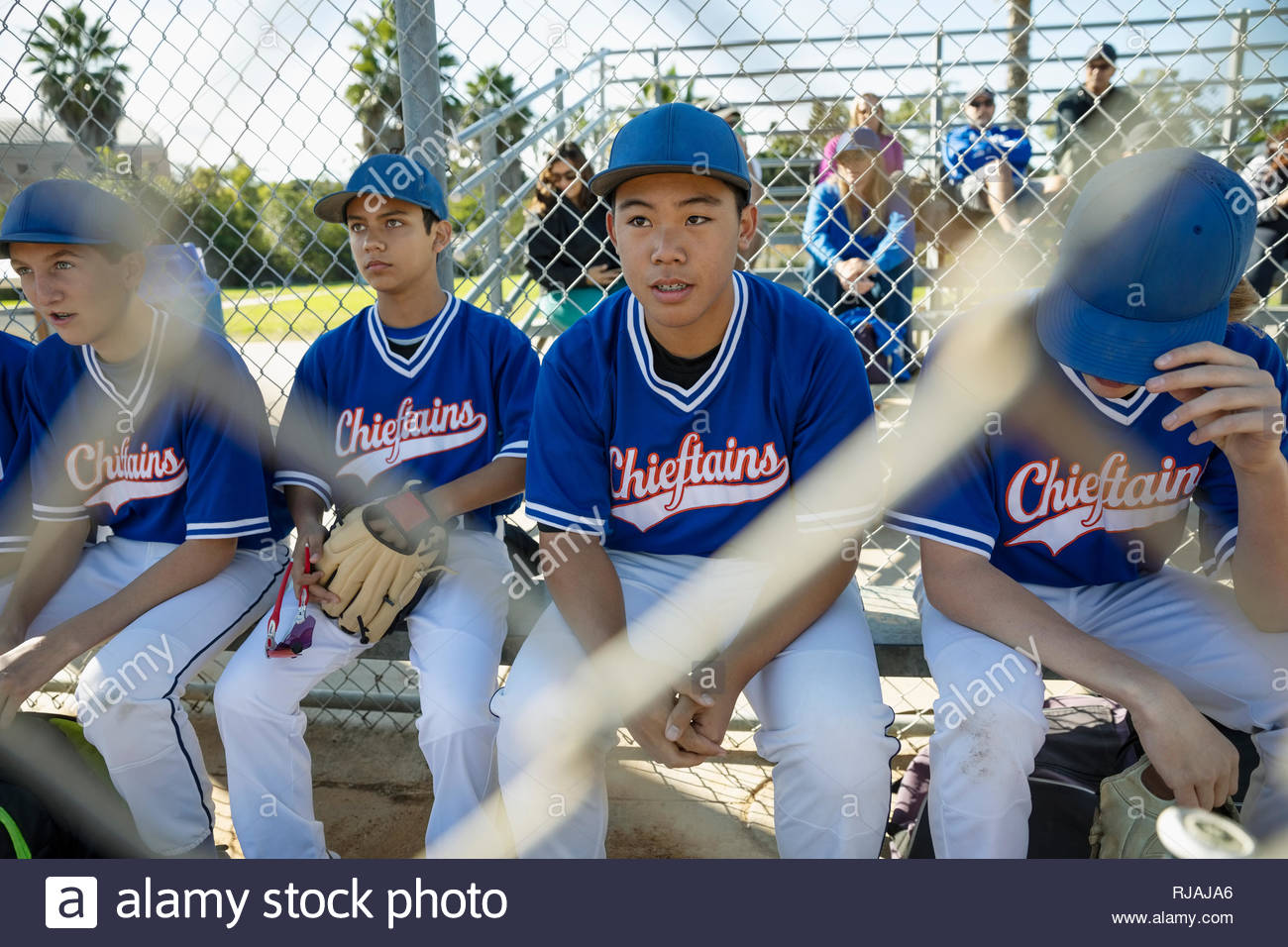 Baseball players on bench Stock Photo Alamy