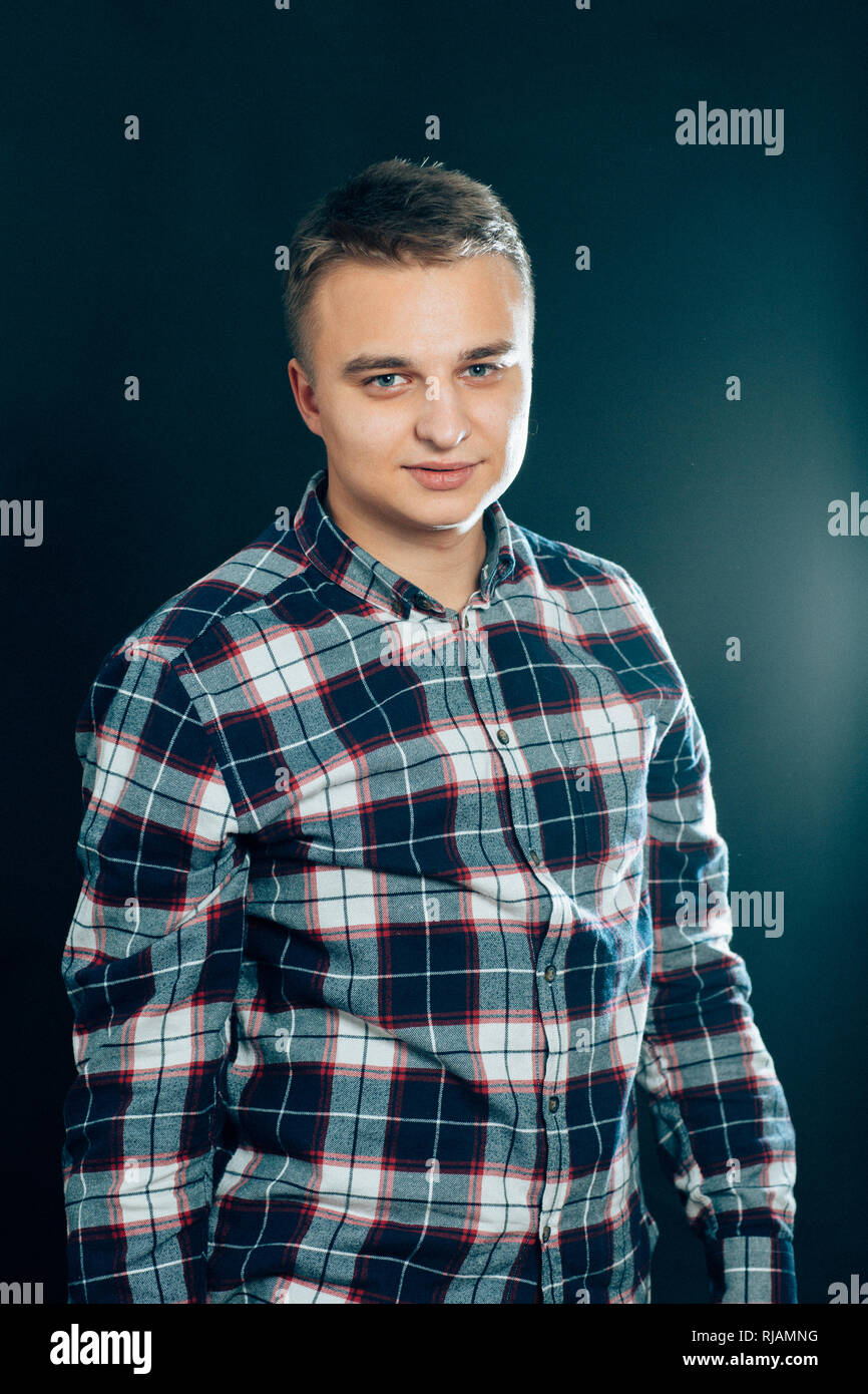 portrait of a young man on a dark background Stock Photo - Alamy