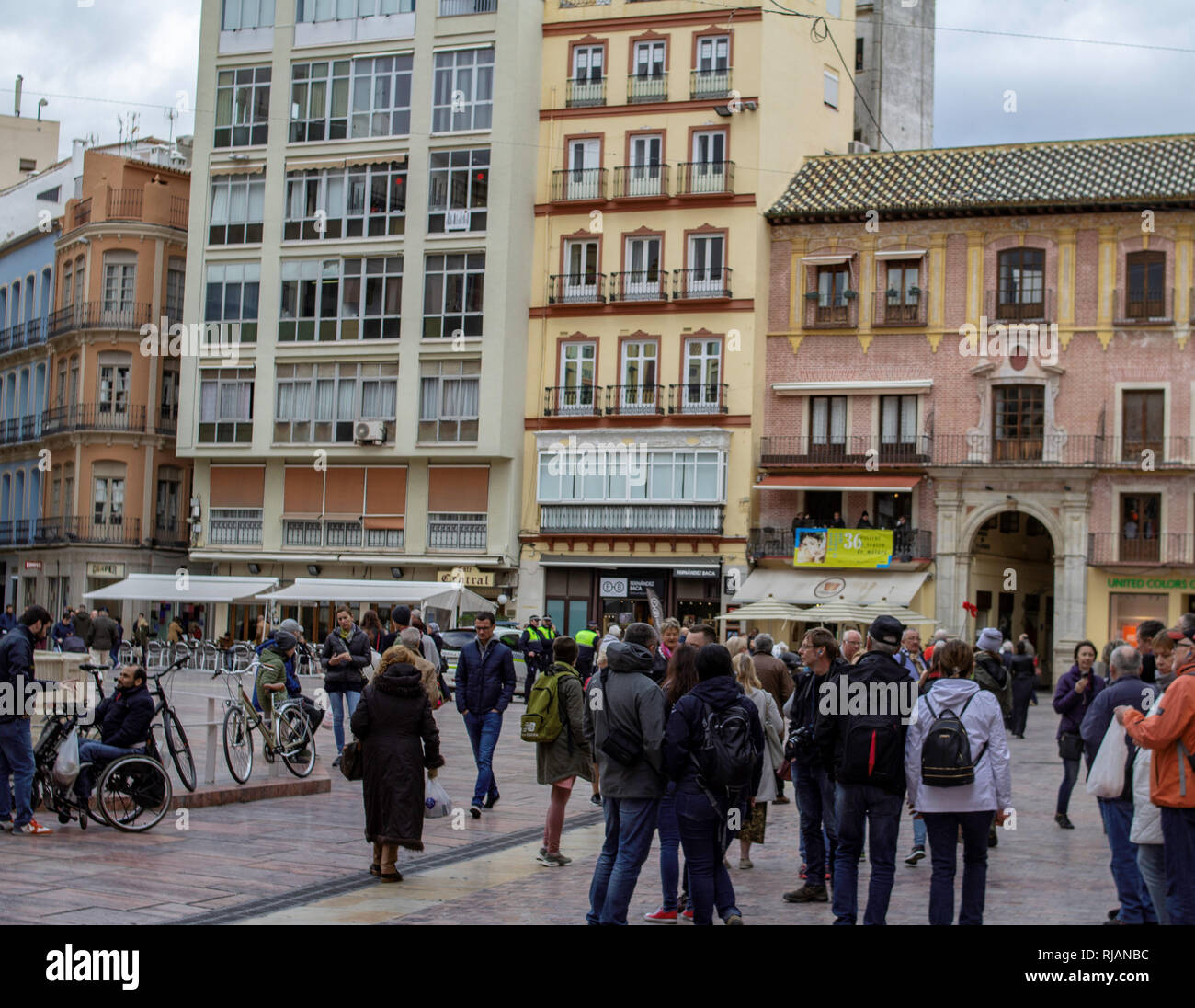 Malaga, Spain. Plaza de la Constitución, people strolling through this central area of Malaga, a popular sightseeing spot. Stock Photo