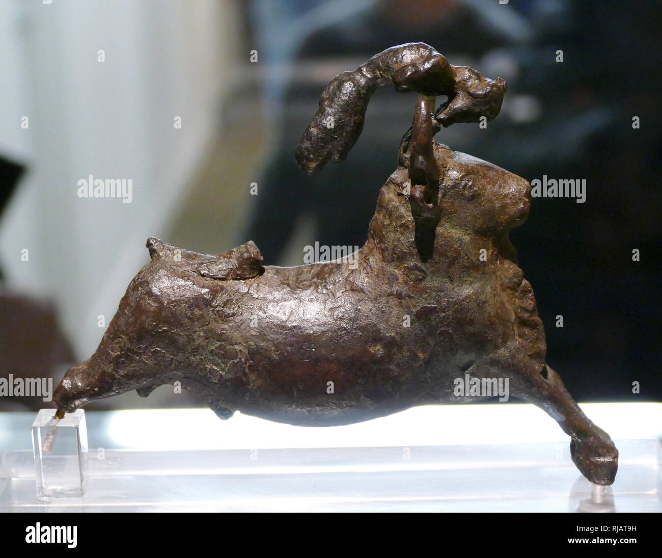 Bronze statuette of bull and an acrobat; Minoan, 15501450 BC. from