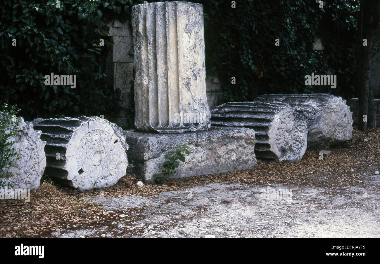 Columns found in the ancient Agora of Athens, located to the northwest of the Acropolis. The Agora's initial use was for a commercial, assembly, or residential gathering place. Stock Photo