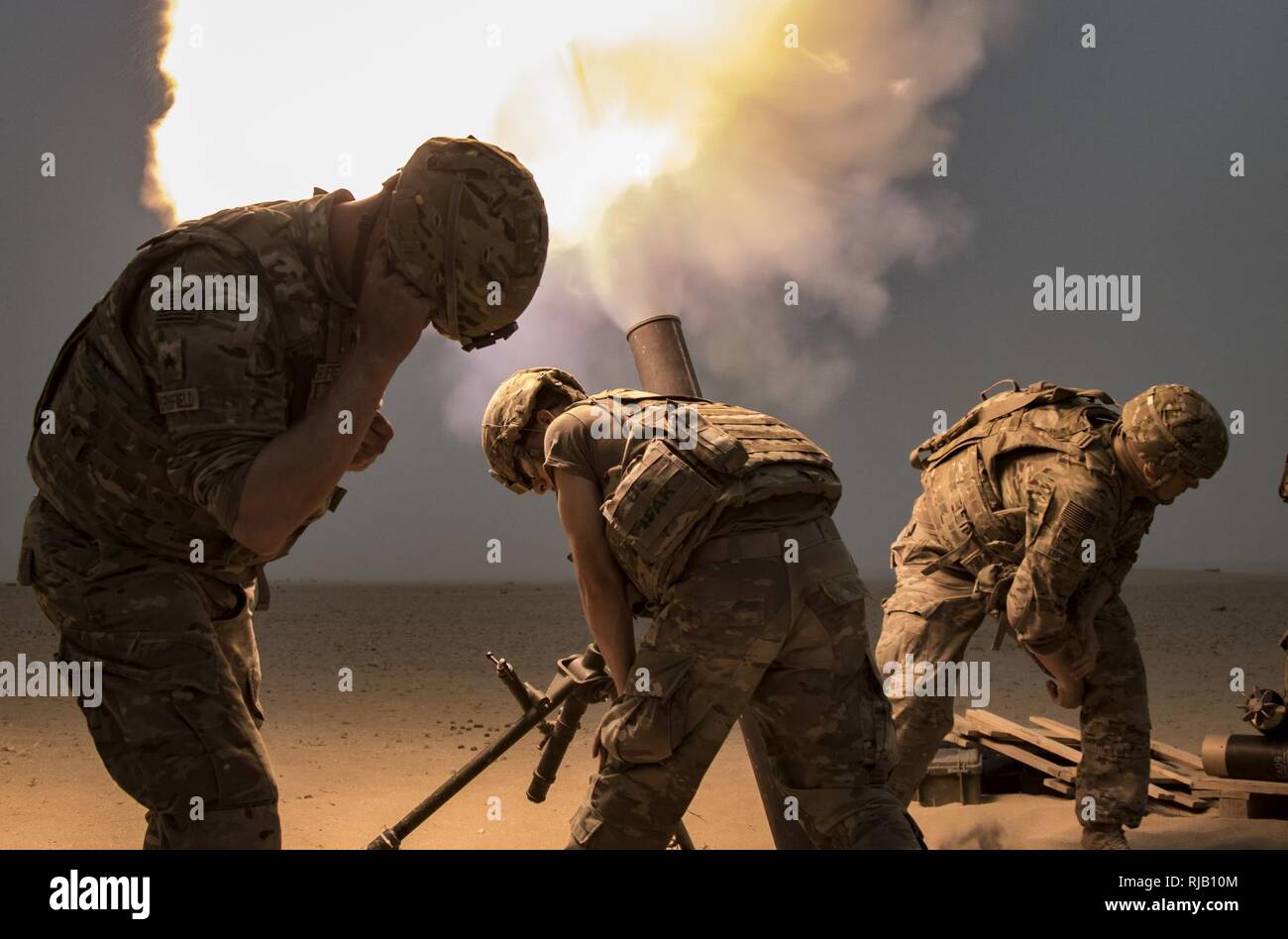 Mortar Soldiers with the 77th Armored Regiment, 3rd Brigade, 1st Armored Division, fire a 120mm mortar round to provide indirect, suppressive fire for infantry Soldiers during a squad live-fire exercise Nov. 3, 2016 at Udari Range near Camp Buehring, Kuwait.  Mortar fire was part of the four-day training exercise that synchronized the capabilities of infantry Soldiers, indirect fire infantrymen and forward observers. Stock Photo